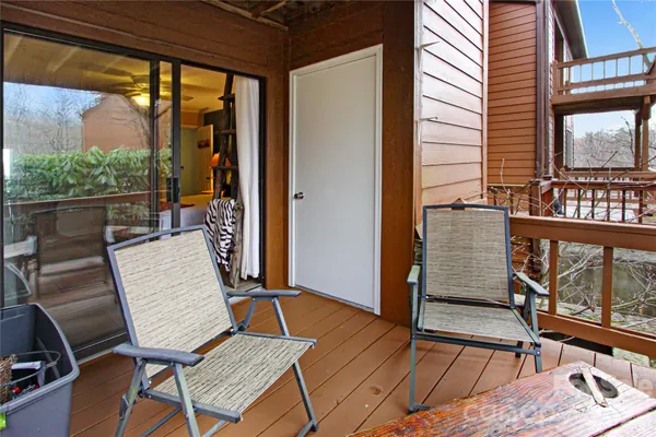 a view of a balcony with furniture