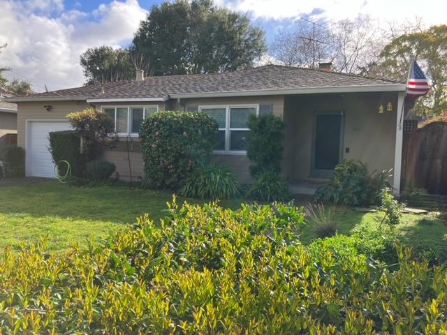 a view of a house with a garden