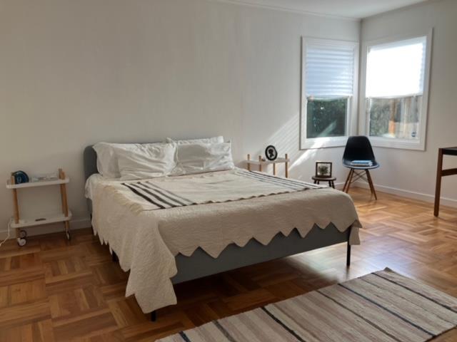 310 McKendry Drive Menlo Park, CA 94025 - Photo 6 of 14 a bedroom with a bed and wooden floor