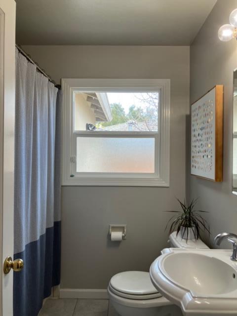 310 McKendry Drive Menlo Park, CA 94025 - Photo 8 of 14 a bathroom with a sink a toilet and a mirror