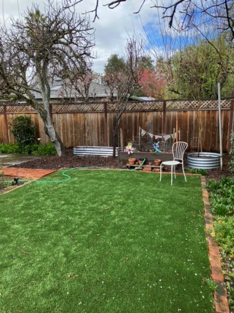 310 McKendry Drive Menlo Park, CA 94025 - Photo 10 of 14 a backyard of a house with table and chairs