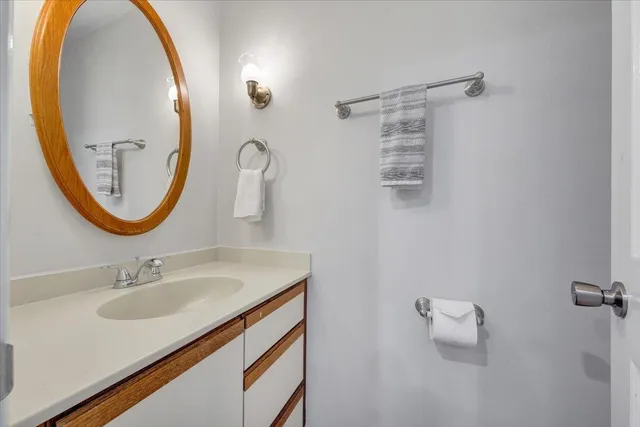 a view of backyard of house with green space