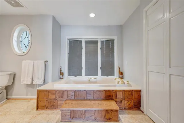 an aerial view of a house with a yard lake lake view and mountain view