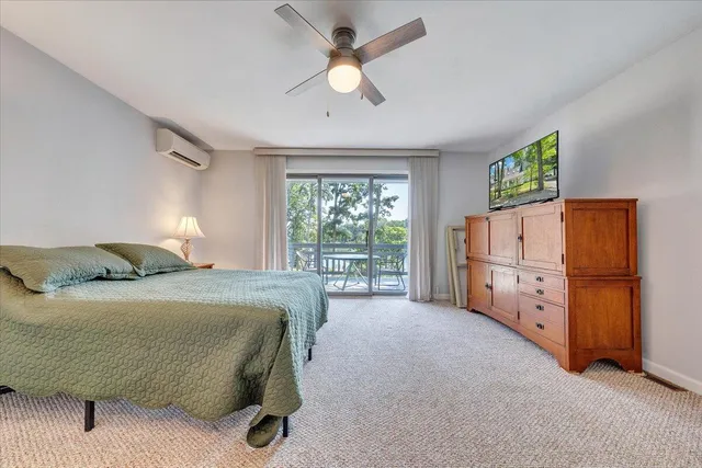 an aerial view of residential house with outdoor space and trees all around
