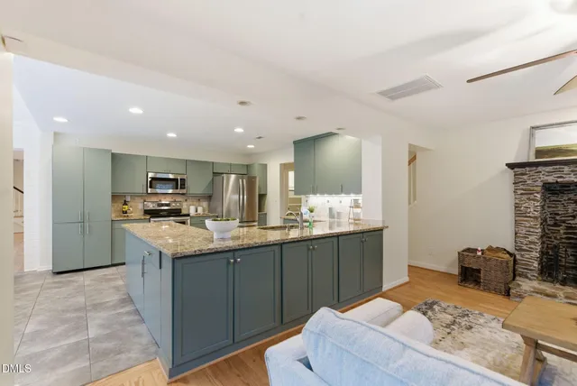 a living room with furniture and a fireplace