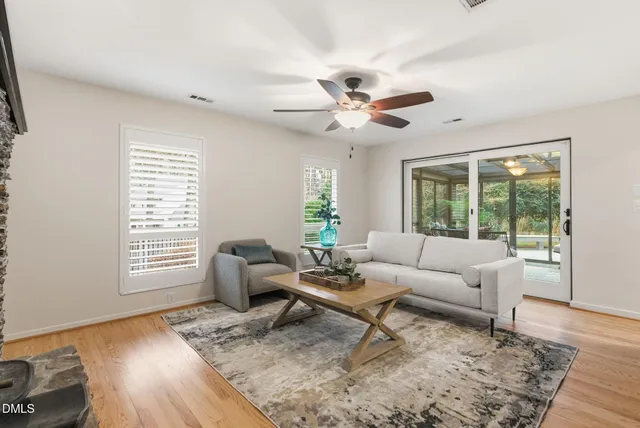 a bathroom with a granite countertop sink a mirror and a shower