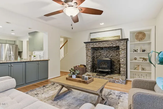 a view of a hallway with wooden floor and entryway