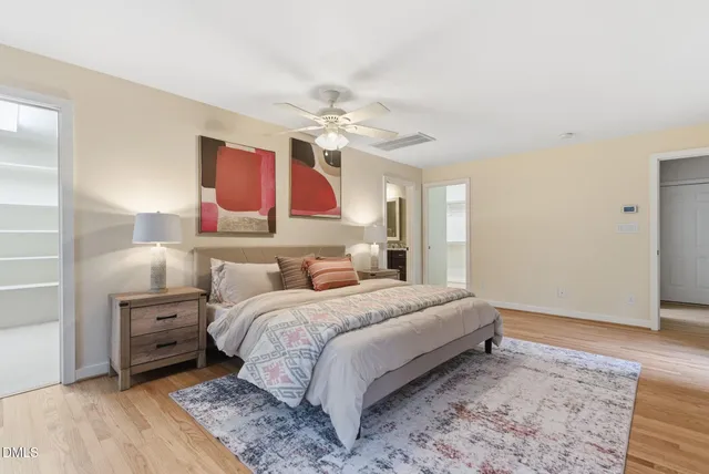 a view of a house with backyard and a tree