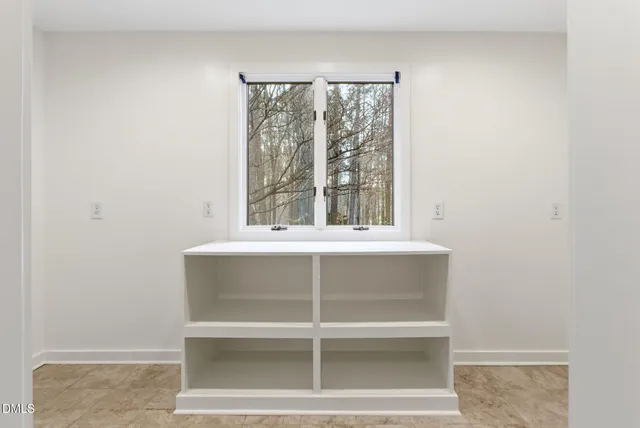 a front view of a house with swimming pool and porch