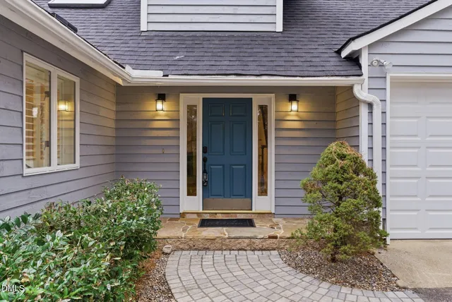 a kitchen with stainless steel appliances granite countertop a refrigerator a stove a sink and a microwave