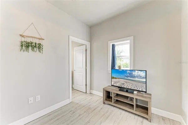 a view of a livingroom with furniture and wooden floor