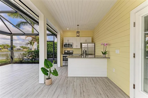 a view of a living room and floor to ceiling window or wooden floor