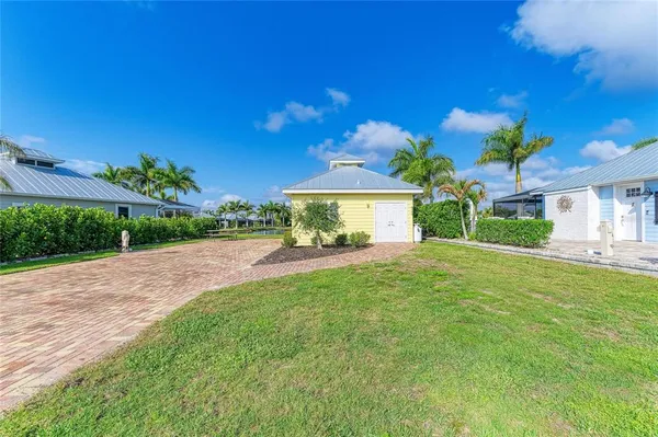 a view of house with yard and green space