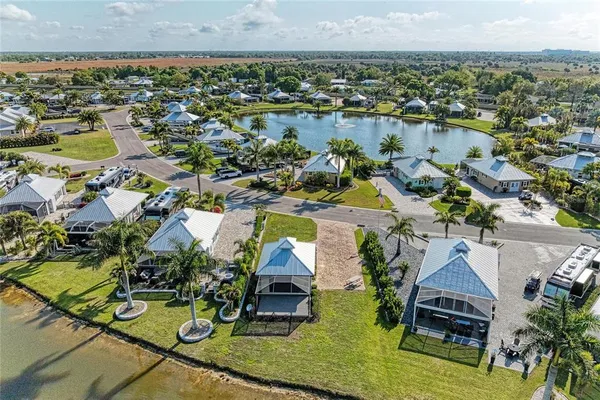 an aerial view of a house with swimming pool and ocean view