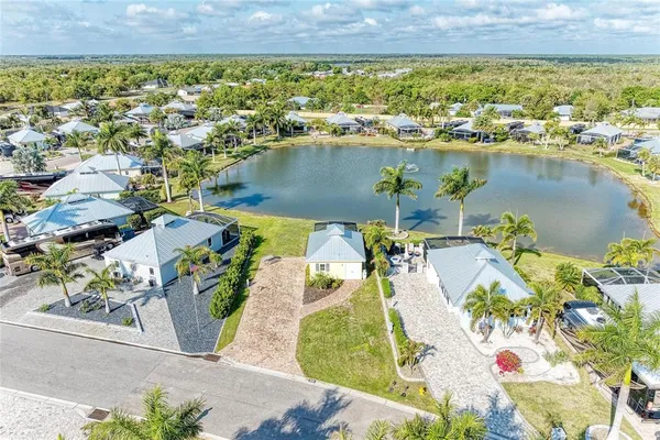 an aerial view of a house with a lake view