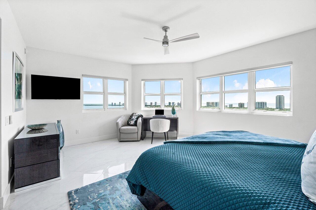 2640 Lake Shore Drive, Unit 2307 Riviera Beach, FL 33404 - Photo 22 of 64 a bedroom with a bed and a window