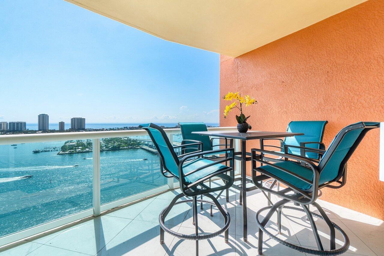 2640 Lake Shore Drive, Unit 2307 Riviera Beach, FL 33404 - Photo 35 of 64 a view of a chairs and table on the terrace