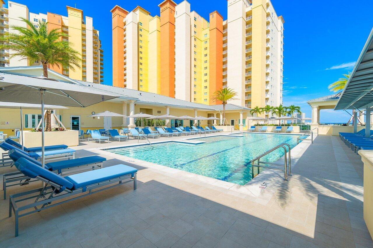 2640 Lake Shore Drive, Unit 2307 Riviera Beach, FL 33404 - Photo 47 of 64 a view of swimming pool with outdoor seating and city view