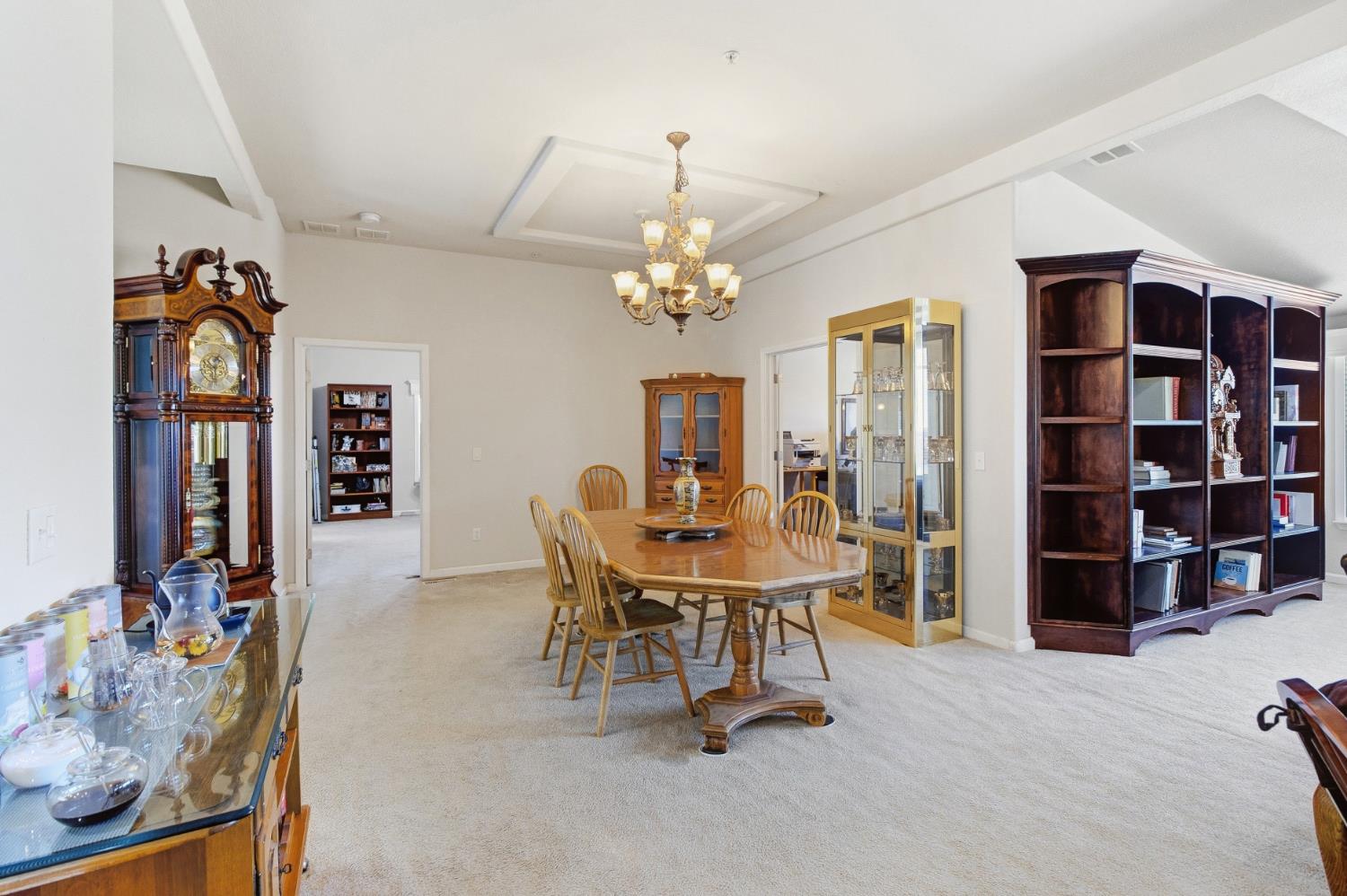 12390 Hobday Road Wilton, CA 95693 - Photo 10 of 92 a view of a dining room with furniture and chandelier