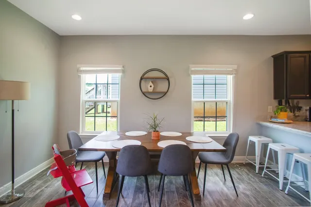 a view of a dining room with furniture window and wooden floor