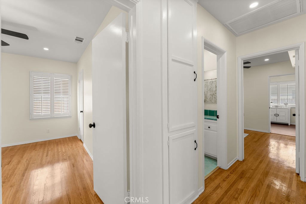14622 Danbrook Drive Whittier, CA 90604 - Photo 20 of 38 a view of a hallway with wooden floor and a bathroom