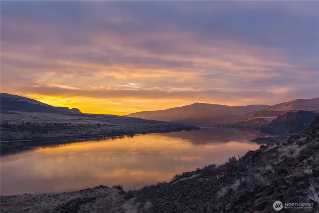 a view of lake with mountain in the background