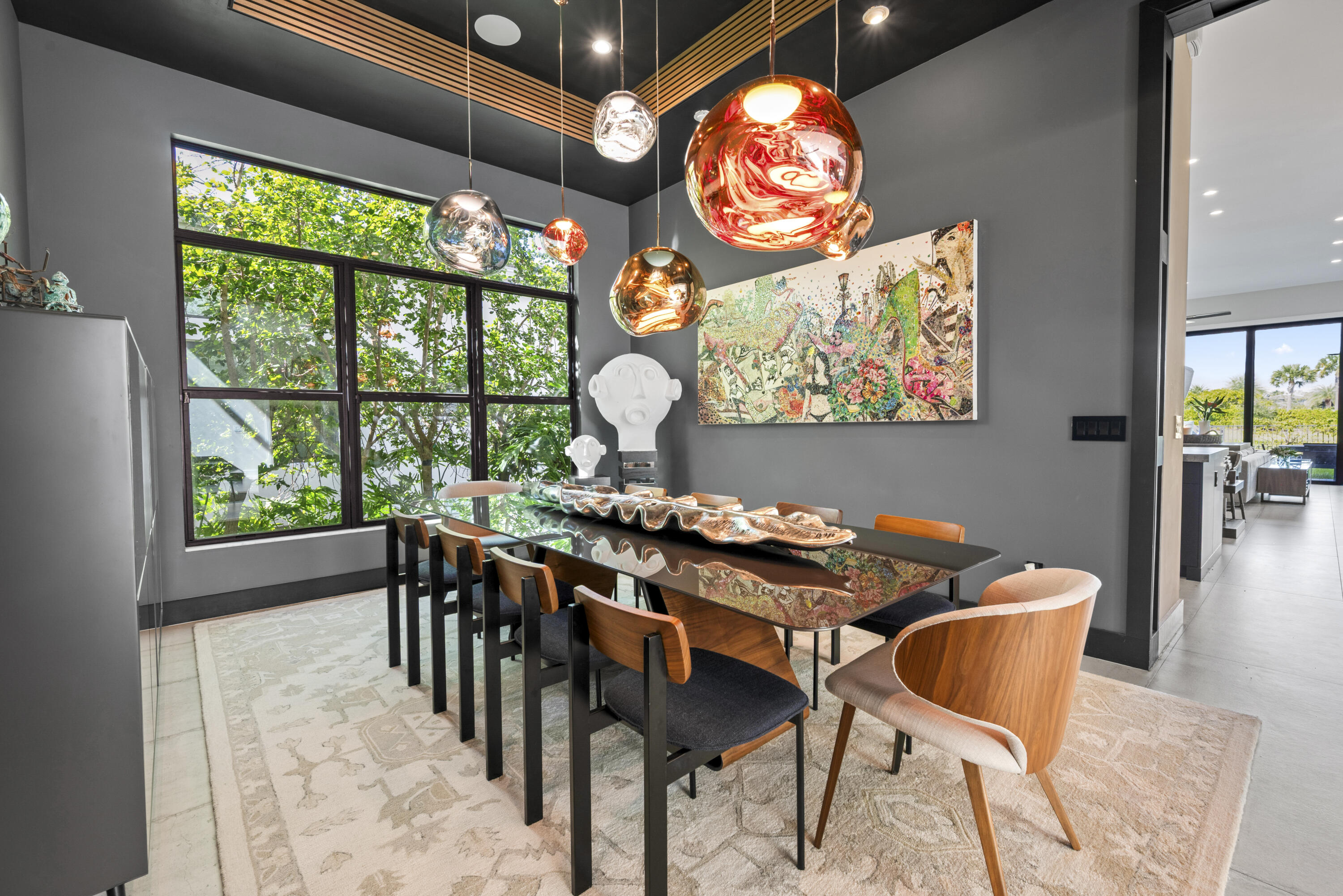 9771 Chianti Classico Terrace Boca Raton, FL 33496 - Photo 21 of 114 a view of a dining room with furniture a chandelier and wooden floor