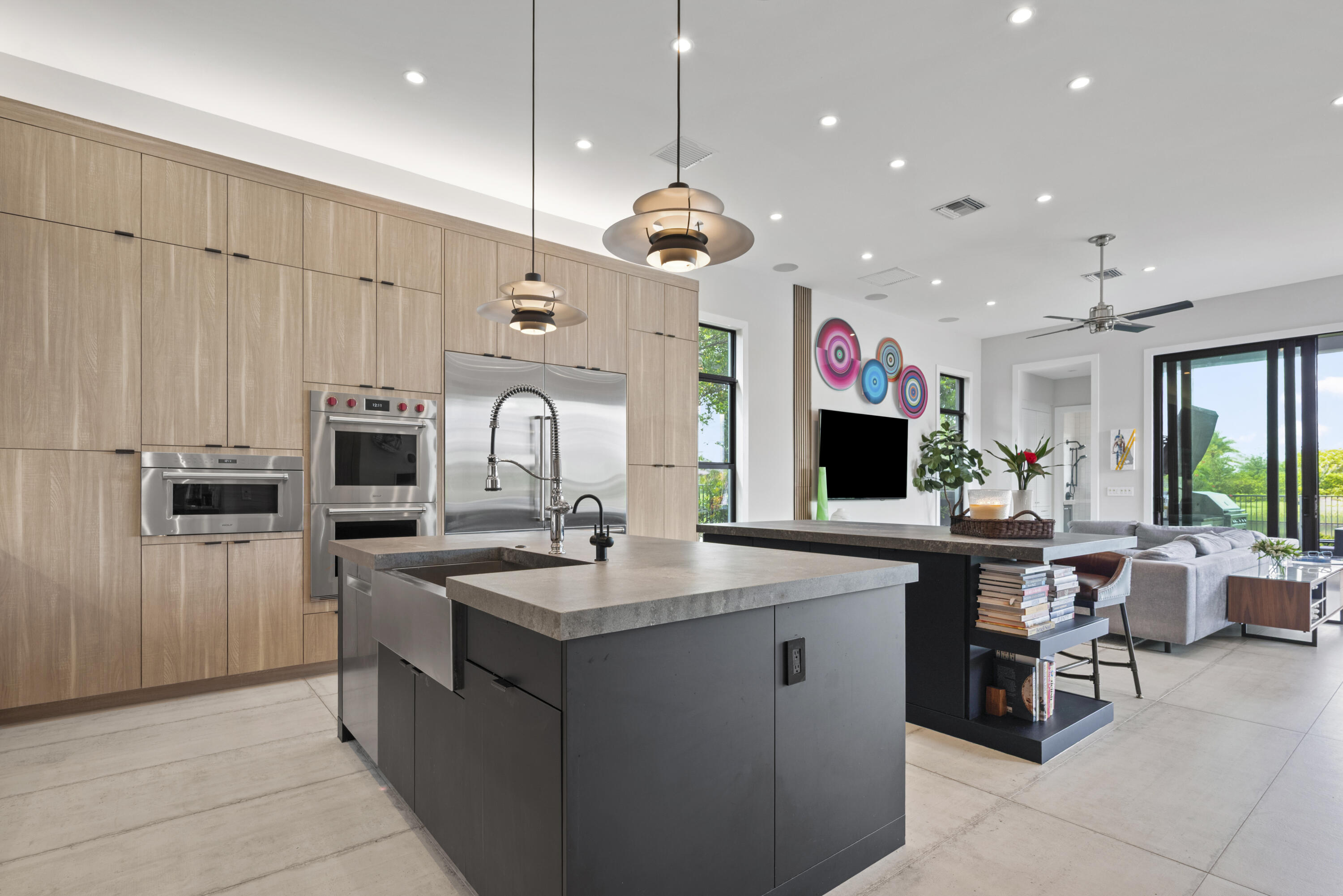 9771 Chianti Classico Terrace Boca Raton, FL 33496 - Photo 23 of 114 a kitchen with kitchen island granite countertop a sink counter top space appliances and cabinets