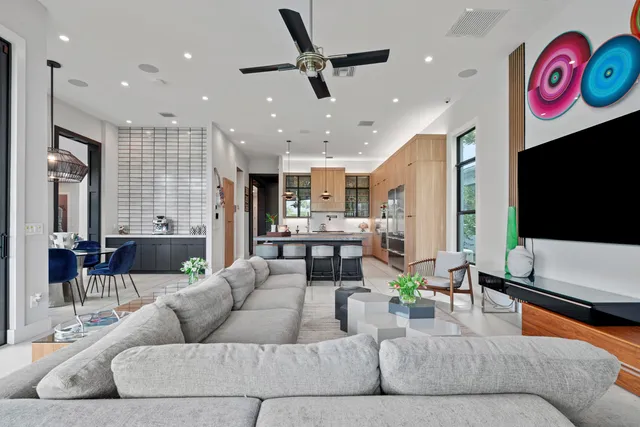 a view of a porch with chairs and a yard