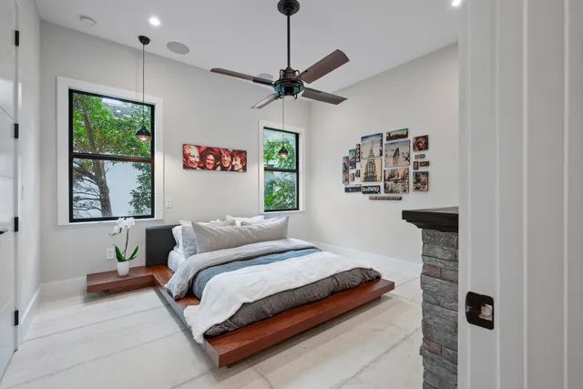 a view of a patio with table and chairs and potted plants