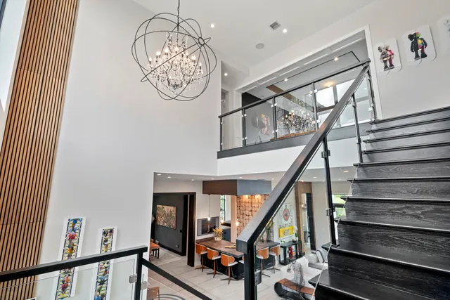 a lobby with furniture and a flat screen tv