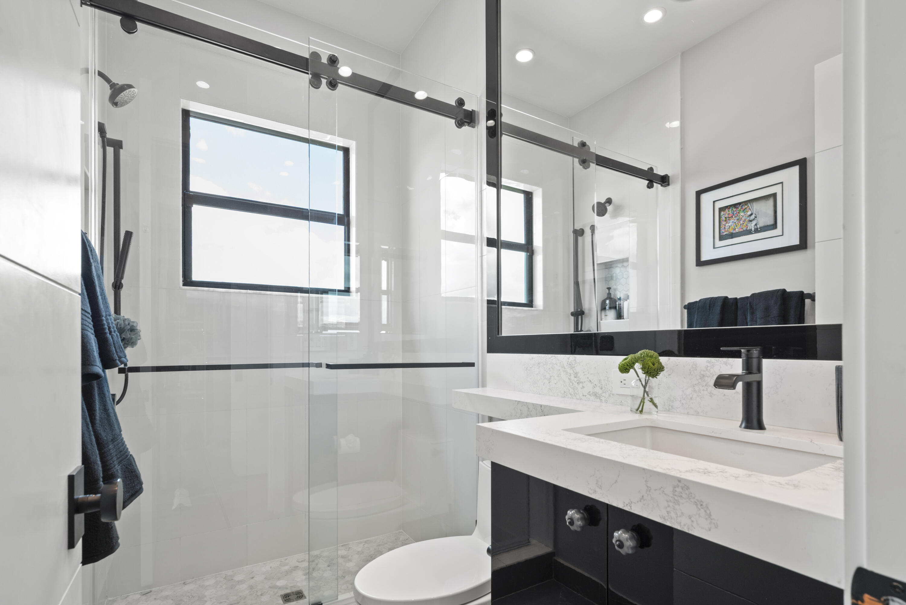 9771 Chianti Classico Terrace Boca Raton, FL 33496 - Photo 72 of 114 a bathroom with a sink toilet a mirror and shower