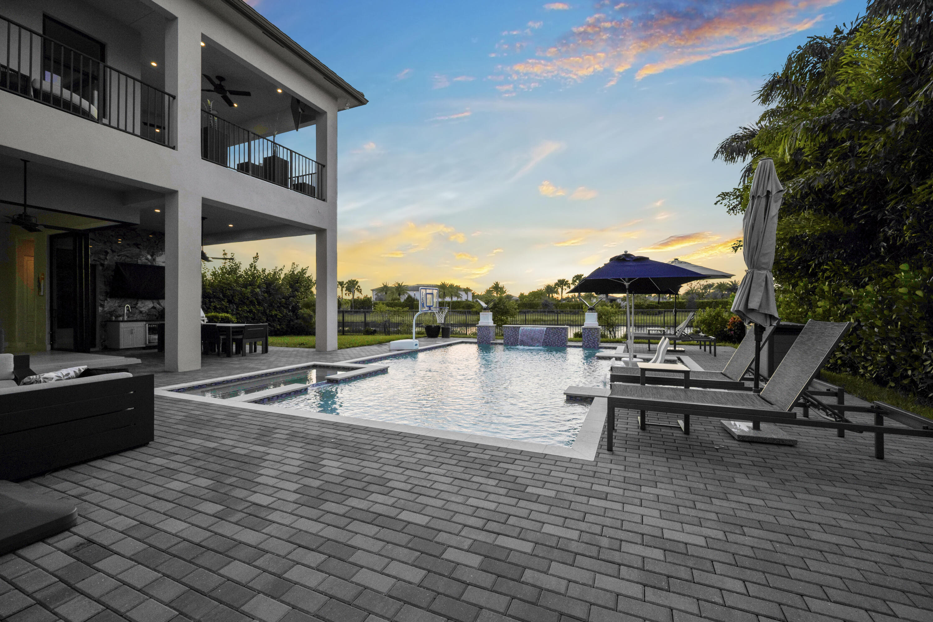 9771 Chianti Classico Terrace Boca Raton, FL 33496 - Photo 92 of 114 a view of a patio with swimming pool table and chairs