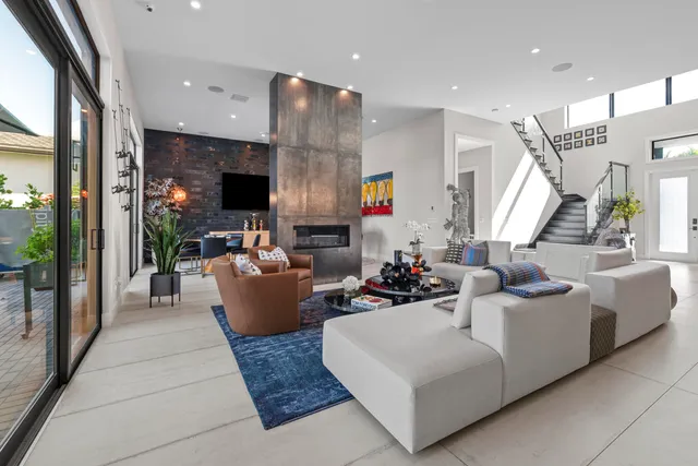 a kitchen with stainless steel appliances granite countertop a sink and a wooden floors