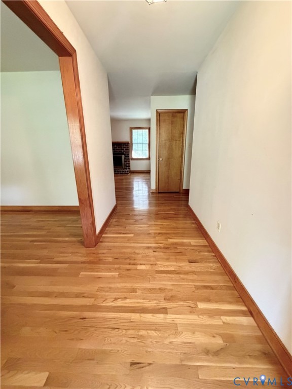 3933 Dunraven Road North Chesterfield, VA 23236 - Photo 15 of 30 a view of empty room with wooden floor and kitchen