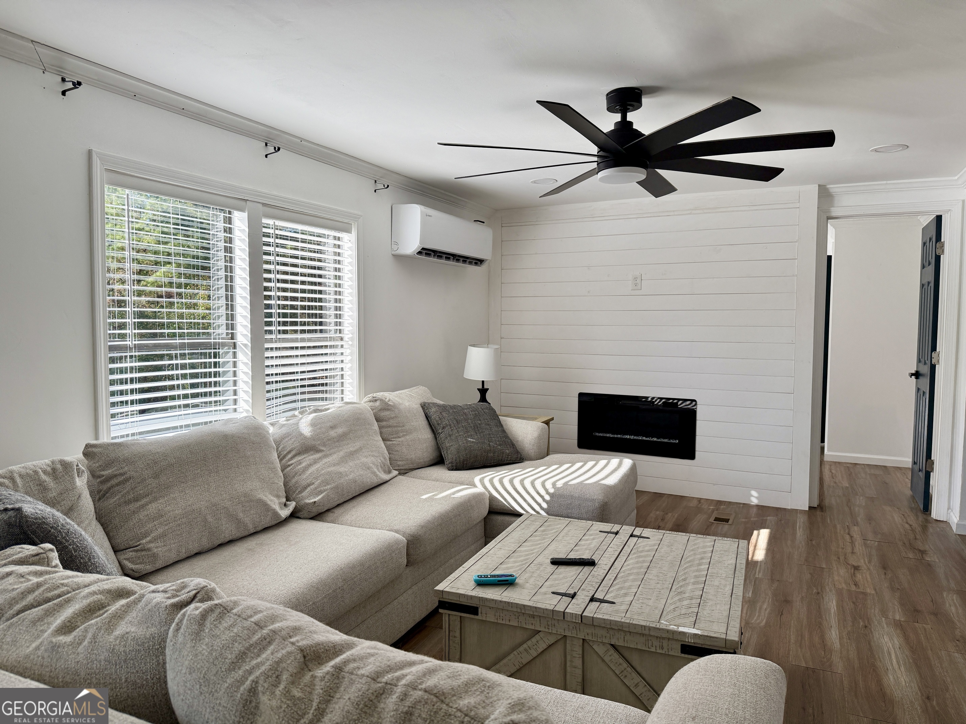 10199 Ga Highway Stapleton, GA 30823 - Photo 12 of 30 a living room with furniture and a fireplace