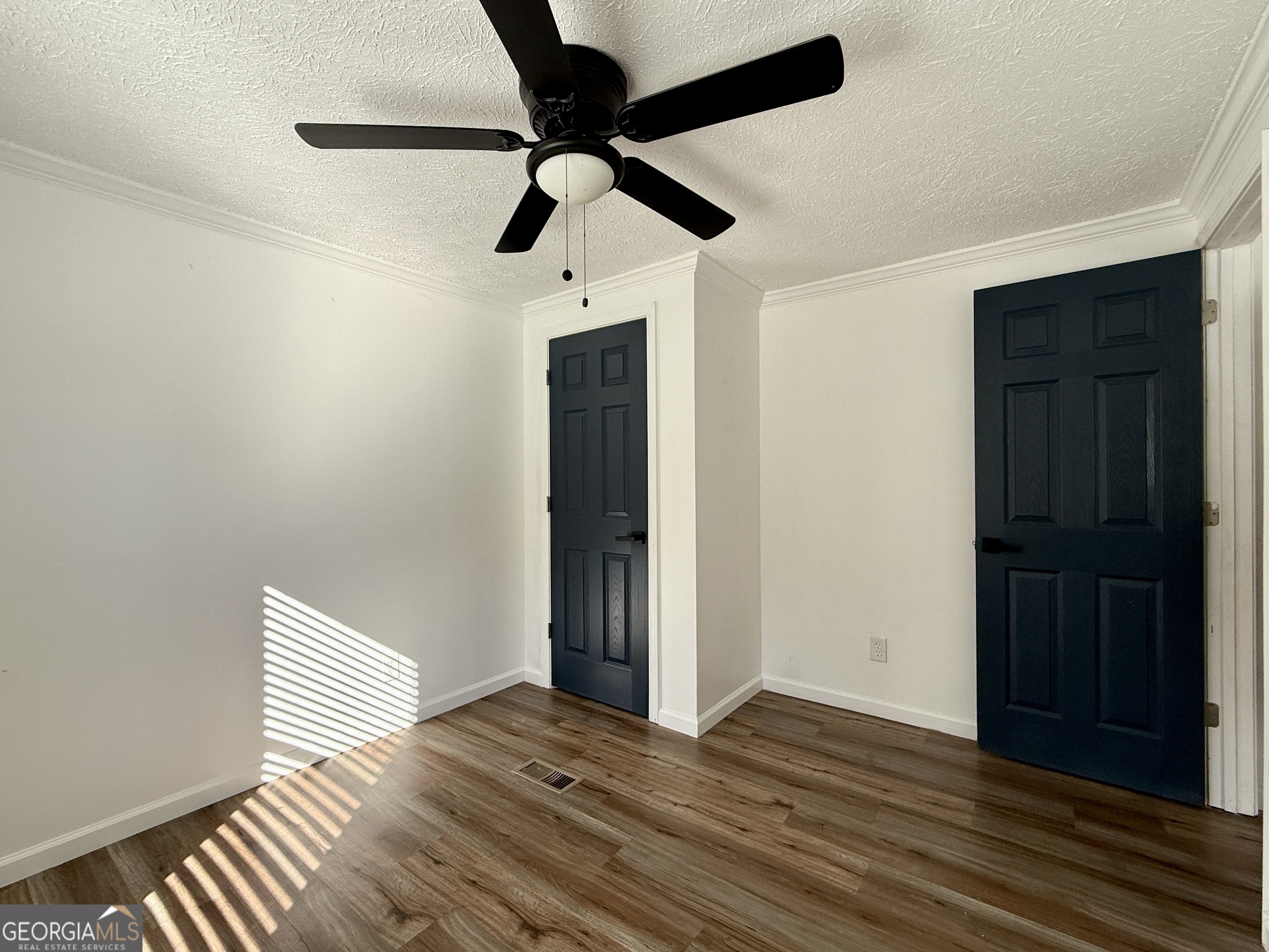 10199 Ga Highway Stapleton, GA 30823 - Photo 18 of 30 a view of empty room with wooden floor