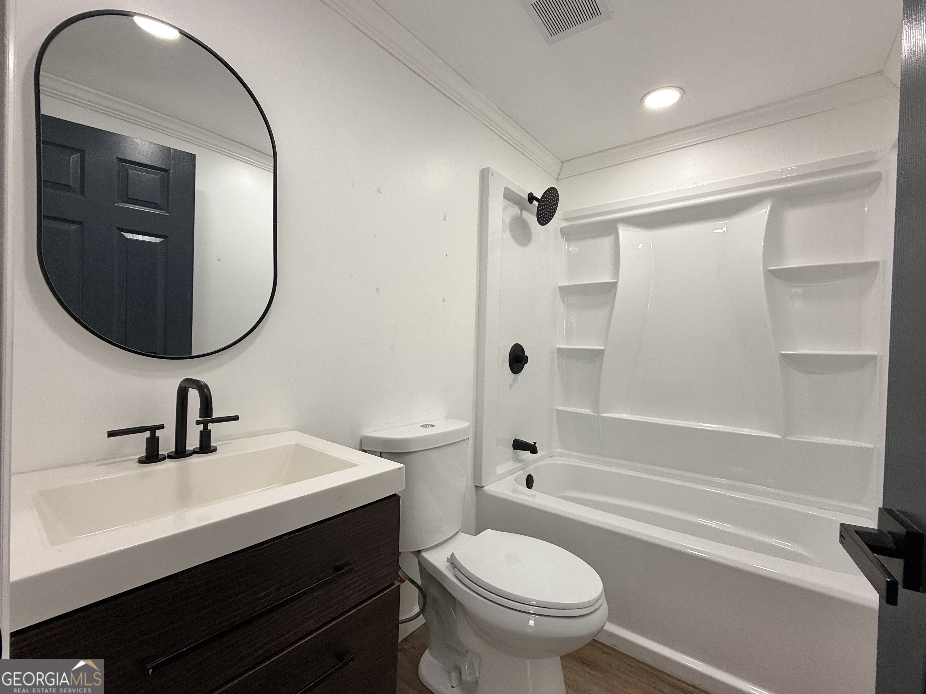 10199 Ga Highway Stapleton, GA 30823 - Photo 20 of 30 a bathroom with a sink a toilet and a mirror