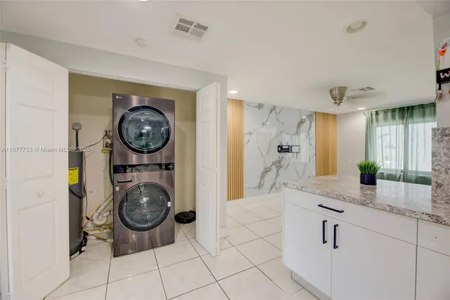 a view of bathroom with washer and dryer