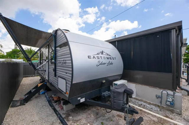 a view of a backyard with sitting area