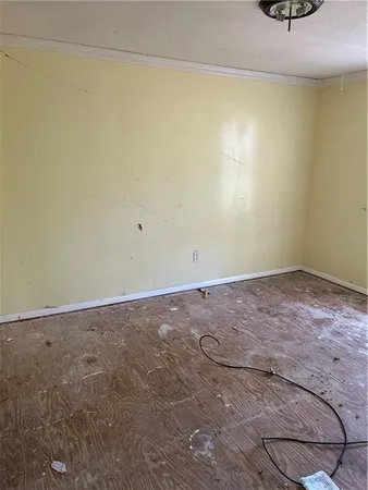 an empty room with a empty space and a window