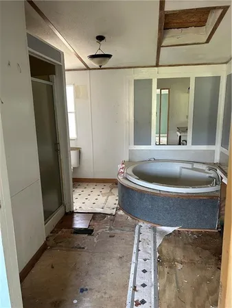 a bathroom with a bathtub and shower