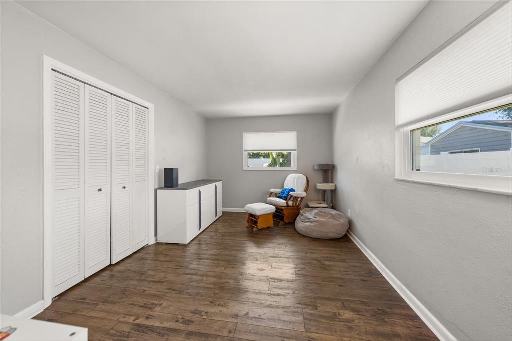 1049 McCarty Street Dunedin, FL 34698 - Photo 15 of 49 a living room with furniture and wooden floor
