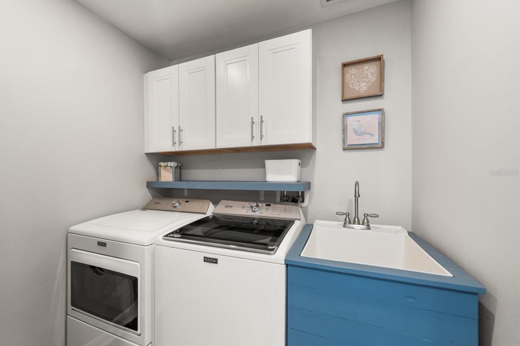 1049 McCarty Street Dunedin, FL 34698 - Photo 23 of 49 a kitchen with a sink cabinets and appliances