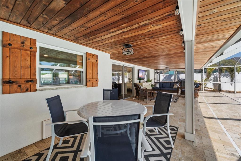1049 McCarty Street Dunedin, FL 34698 - Photo 24 of 49 a view of a dining room with furniture window and outside view