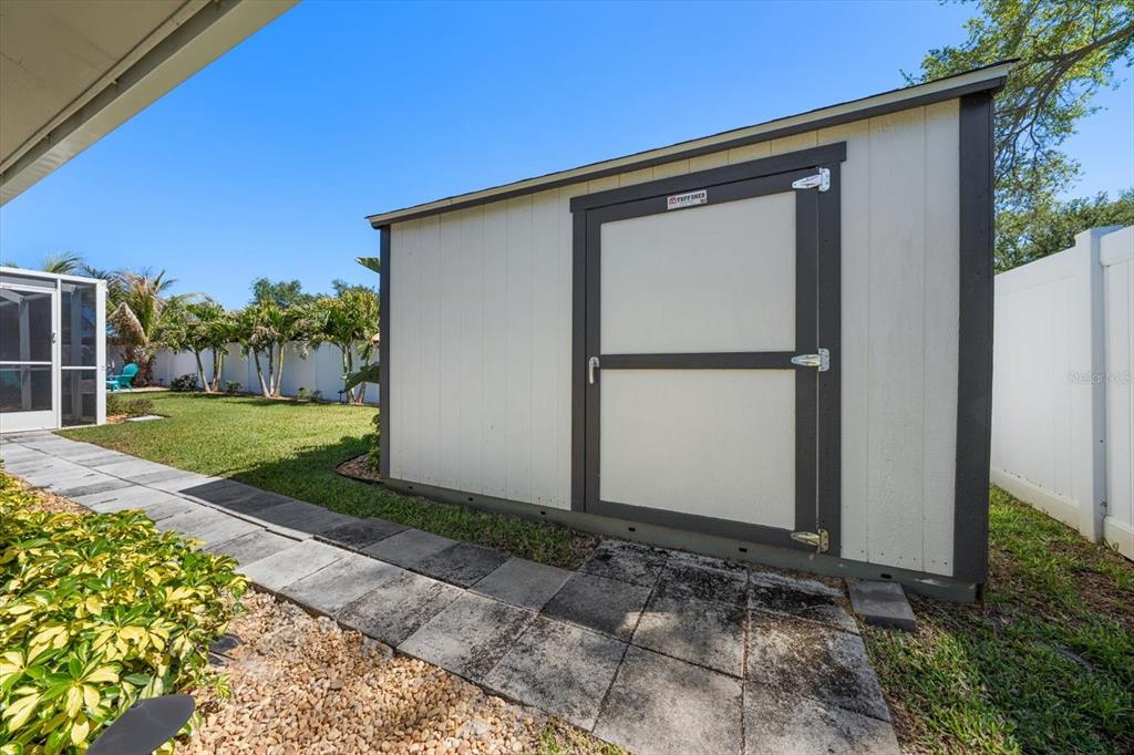1049 McCarty Street Dunedin, FL 34698 - Photo 32 of 49 a front view of a house with garden