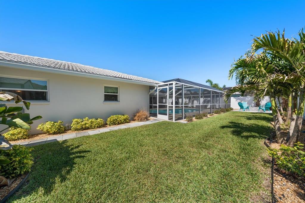 1049 McCarty Street Dunedin, FL 34698 - Photo 42 of 49 a view of front of house with a yard