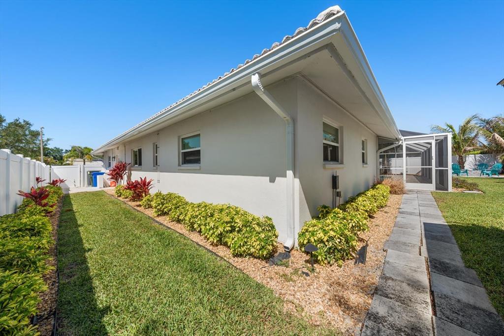 1049 McCarty Street Dunedin, FL 34698 - Photo 43 of 49 a front view of a house with a yard