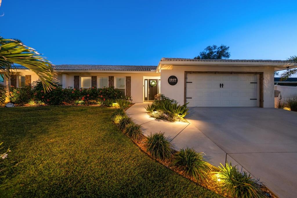 1049 McCarty Street Dunedin, FL 34698 - Photo 46 of 49 a view of a house with a yard