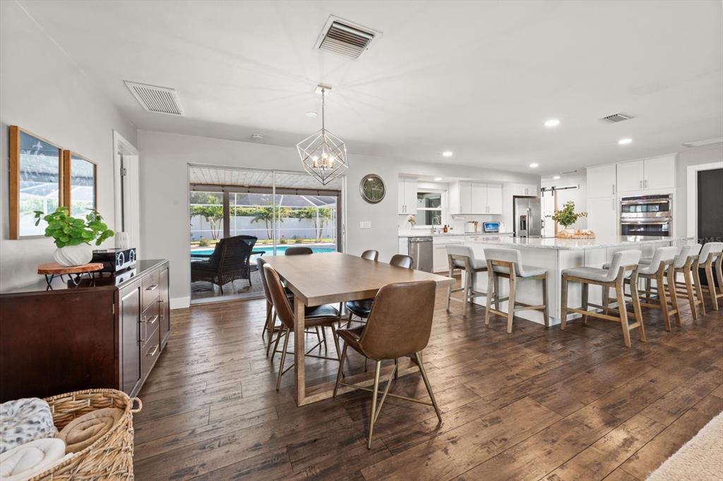 1049 McCarty Street Dunedin, FL 34698 - Photo 10 of 49 a view of a dining room with furniture window and wooden floor